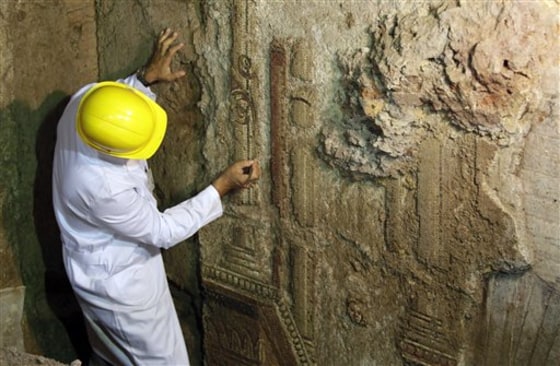 An archaeologist works on a mosaic discovered in downtown Rome. 